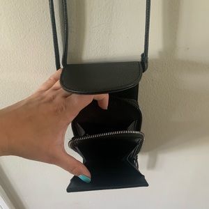 Black crossbody purse with slots for cards and cell
